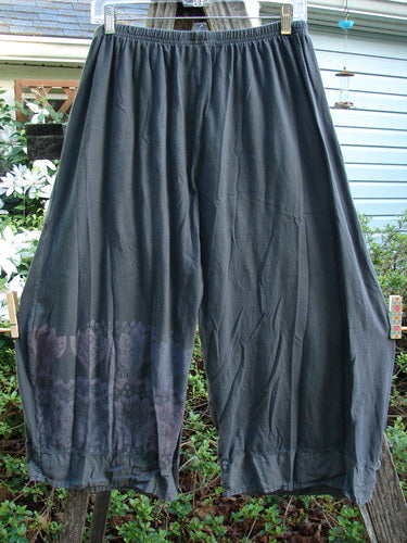 Barclay Flutter Bottom Crop Cargo Pant Tri Floral Raven Size 0, featuring unique fluttered hems, elastic waist, dual front floppy cargo pockets, and artistic lower leg designs, embodying BlueFishFinder's vintage style.