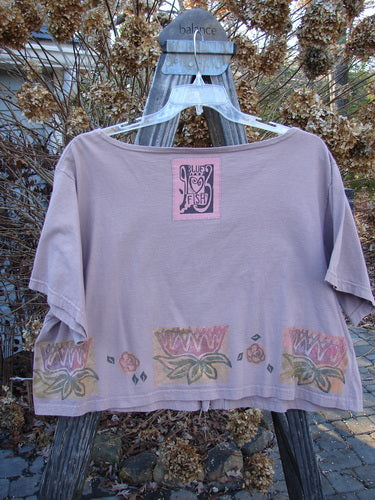 1993 Travel Top Lilly Pads Dried Rose Size 2: Cotton t-shirt with a lovely crop shape, featuring a dillydally lilly pad theme paint, a Blue Fish 93 patch, and wooden accented buttons. Bust 54, Waist 54, Length 21.
