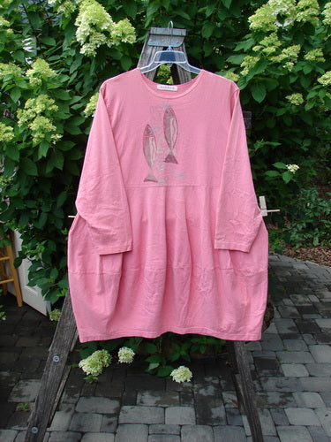 1997 Brenton Dress Two Fish Tulip Size 2 displayed on a wooden ladder outdoors, featuring long sleeves, a rounded neckline, graphic fish print, sectional skirt, and deep side pockets. Vintage Blue Fish Clothing.