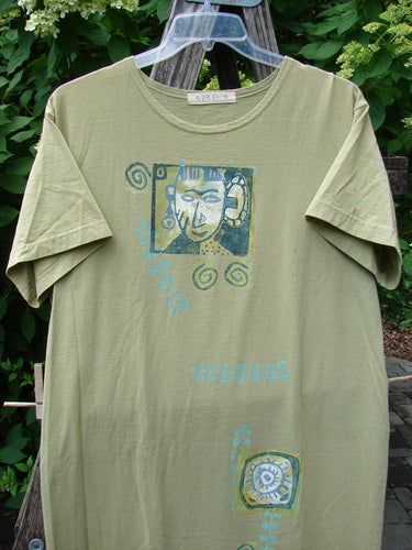 1997 Aquavella Dress Modern Gal Pear Size 1 features abstract cubist face and spiral motifs on light olive-green fabric, showcasing vintage Blue Fish Clothing's creativity and individuality.