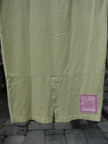 1997 Aquavella Dress Modern Gal Pear Size 1 in medium-weight olive fabric with a center slit and purple label, showcasing unique folds and creases, reflecting Bluefishfinder's vintage charm and creative individuality.