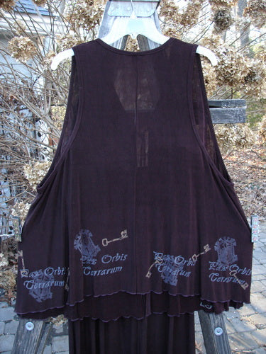 1999 Acetate Streamer Moonbeam Duo Key Deep Burgundy Size 1: A purple shirt with a logo on it and a black tank top with a key design on it.