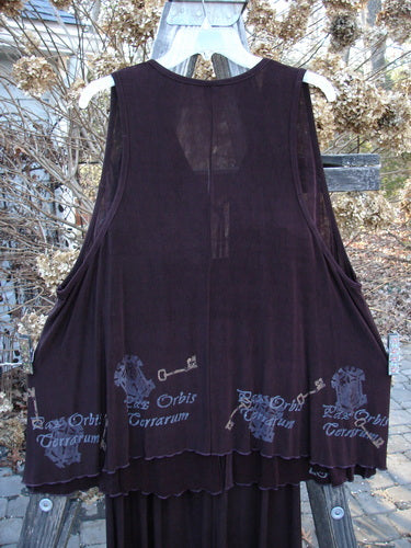 Streamer Vest and Moonbeam Skirt from 1999 Holiday Winter Collection, featuring a Celtic key design and lettuce edging in Deep Burgundy, emphasizing a unique A-line shape and elegant drape.