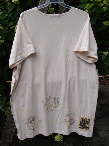 1997 Mauritius Top Sea Coral Powder OSFA, featuring sea-fan-like prints in gold, brown, and gray on light-beige cotton, with a black patch design, hanging outdoors against greenery.