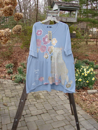 Barclay NWT Three Quarter Sleeve Happiness Tunic Big Kitty Cat Blue Sky Size 0 on rack, featuring a unique script hem, drawcord back, and artistic print, highlighting Bluefishfinder.com's creative vintage style.