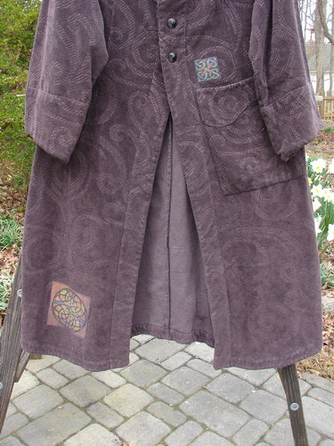 2000 Patched Upholstery Diwmach Coat Celtic Time Aubergine Size 0 featuring a luxurious damask paisley pattern, large pocket, scalloped neckline with vintage buttons, belled sleeves, and pleated back.