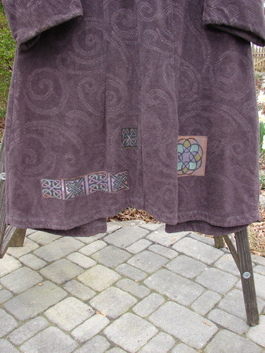 2000 Patched Upholstery Diwmach Coat Celtic Time Aubergine Size 0 displayed on a rack, showcasing its rich tapestry cotton fabric, colorful patches, and intricate damask paisley pattern.