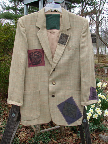 1994 Patched Blazer Elements Grass Wheat Tweed OSFA: Vintage blazer with patchwork design, square shoulder pads, handkerchief slit pocket, and nature-themed patches, fully lined with three-button closure and two front pockets.