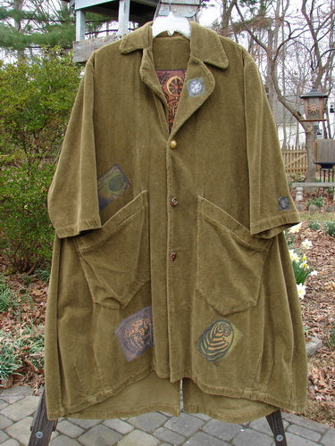1998 Patched Tapestry Coat Forest Path Glazed Tile OSFA displayed on a swinger, featuring a heavy, richly textured cotton fabric with angular pockets, a stand-up collar, and vintage buttons.