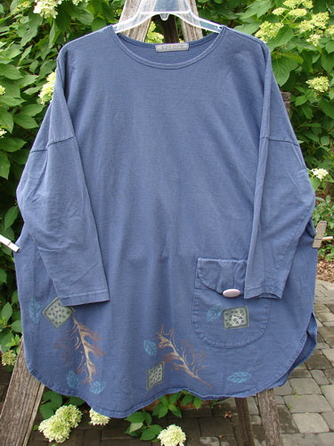 1996 Long Sleeved Pop Top Fall Leaves Niagara OSFA displayed outdoors, showcasing its loose fit, rounded hem, single buttoned patch pocket, and leaf motif along the bottom. Perfect for expressing individual style.