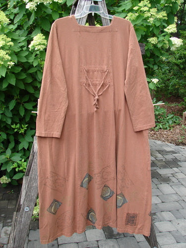 The 1998 Mandolin Dress Lucky Horseshoe Rockwood in Size 2 features a rust-brown, ankle-length design with unique front pocket and hem motifs, embodying Bluefishfinder.com's vintage elegance and creativity.