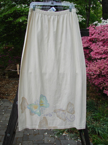 1999 NWT Straight Skirt Butterfly Natural Size 2 – A white organic cotton skirt with butterfly-themed paint around the hem and a full elastic waistband, part of the 1999 Summer Collection.