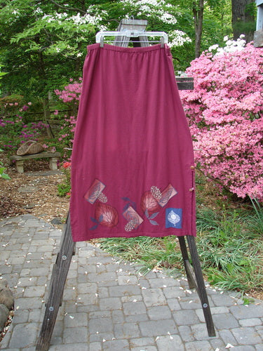 Barclay Panel Nut Button Vented Skirt Oakleaf Madder Size 2 on a rack, showcasing straighter shape, vented sides with nut buttons, and leaf-themed hemline.