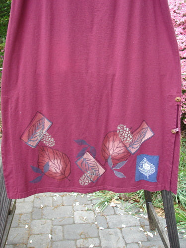 Barclay Panel Nut Button Vented Skirt Oakleaf Madder Size 2, featuring a straighter shape with tall vented sides, dual nut-like buttons, and a leaf-themed design around the hemline.