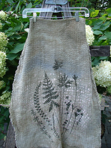 Barclay Crinkle Cotton Scarf Morning Fern Mottled Wheat OSFA: Natural cloth with fern and wildflower silhouettes, highlights the organic texture and artistic detail, embodying Bluefishfinder.com's vintage-inspired elegance and creative expression.
