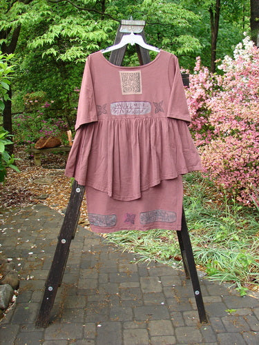 1993 Picnic Dress Fern Boysenberry OSFA on a wooden rack, featuring a gently rounded V neckline and flounce detail, with a vintage signature patch visible.
