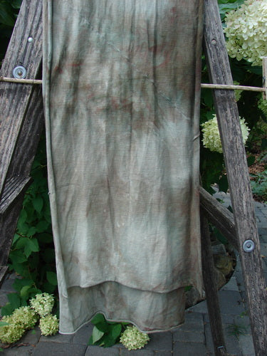 Barclay Diagonal Sectional Scarf Wrap Unpainted Mottled Night Storm OSFA draped on an outdoor ladder, showcasing its unique tie-dyed pattern and delicate curly edges, embodying Bluefishfinder.com's vintage creative style.