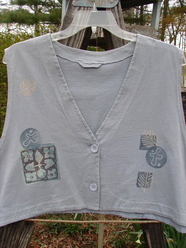 1994 Spruance Vest Topiary Solstice Blue OSFA, featuring intricate designs, dual paper button closure, and a wide A-line flare, perfect for layering.