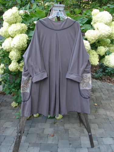 1998 Tiddly Winks Jacket Butterfly Madeira Size 2 displayed outdoors on a wooden trestle, showcasing its loose fit, inverted pleat, and floral-accented pockets, embodying BlueFishFinder's vintage style.