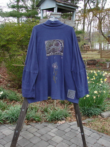 1995 Reprocessed Deco Jacket Greyhound Royal Orchid OSFA on a mannequin, showcasing its dense, nubby texture, double buttonhole closure, drop Dolman shoulders, and deep V neckline with stand-up rear collar.