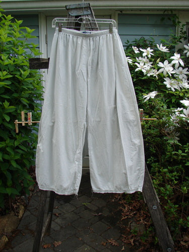 Barclay Batiste Tiny Flutter Pocketless Pant, Natural Size 0, features a unique flutter hem, full elastic waist, and straight shape. Made from lightweight cotton batiste, perfect for summer style.