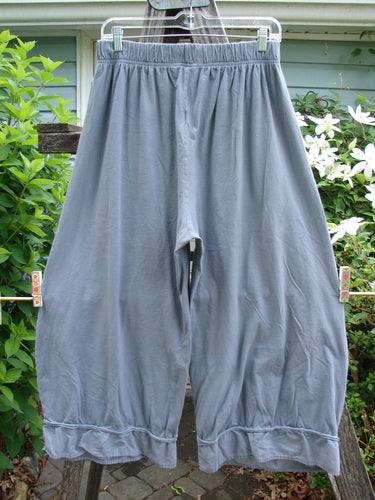 Barclay Lightweight Crop Nepenthe Pant Mixed Garden Blue Grey Size 0, featuring a unique bottom flutter and thick elastic waist, showcasing rolled raw lower panels in a fern frond theme, ideal for summer wear.