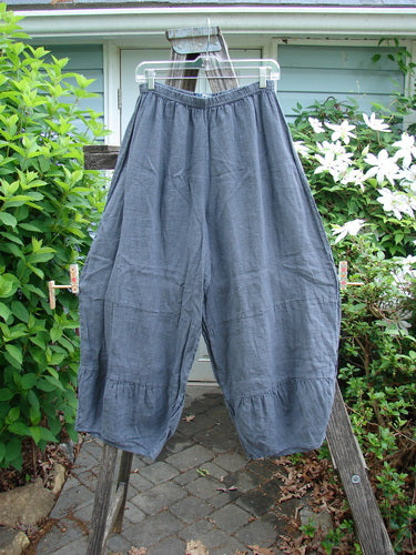 Barclay Linen Meadow Pant in Cross Dye Steel, Size 0, featuring a full elastic waist, wide flowy shape with horizontal panels, and slightly narrowing lower leg seams, perfect for summer.