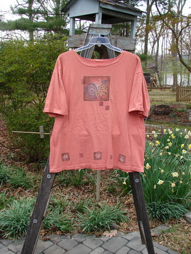 Barclay Short Sleeved Tee Morning Hen Glow Size 1 displayed on a wooden stand, showcasing its thin rolled neckline, short sleeves, and vintage theme paint.