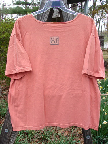 Barclay Short Sleeved Tee Morning Hen Glow Size 1 displayed on a wooden swinger, showcasing rounded neckline, short sleeves, and vintage theme paint.