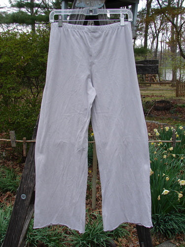 Barclay NWT Simple Cha Cha Pant Unpainted Ricepaper Size 0 hanging on a clothesline, showcasing flared curly bottoms and shorter inseam, made from lightweight organic cotton for easy mixing and matching.