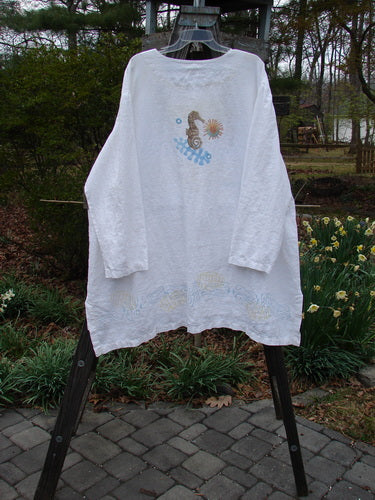 2000 Linen Beach Cardigan Seahorse White Size 2 displayed on a rack, featuring deep front pockets, oversized buttons, and a seahorse design.
