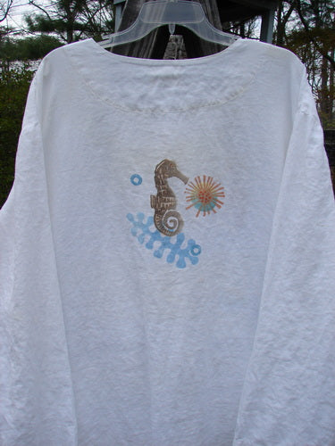 2000 Linen Beach Cardigan Seahorse White Size 2 featuring seahorse and flower design, deep front pockets, oversized textured buttons, and an A-line sweep with a shirt tail hemline.