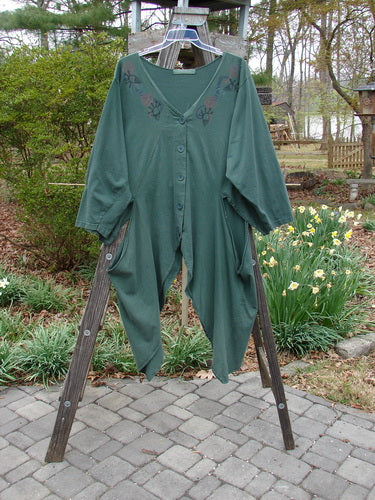 1994 Calligrapher's Jacket Abstract Deep Sea OSFA displayed on a wooden rack, showcasing its wide painted neckline, long open side vents, and unique sectional panels.