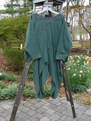1994 Calligrapher's Jacket Abstract Deep Sea OSFA displayed on a wooden ladder, showcasing its wide painted neckline, long open side vents, and knotted side tails.