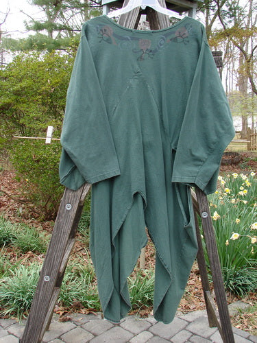 1994 Calligrapher's Jacket Abstract Deep Sea OSFA draped over a wooden ladder, showcasing its wide painted neckline, long open side vents, and diagonal front sectional panels in perfect vintage condition.