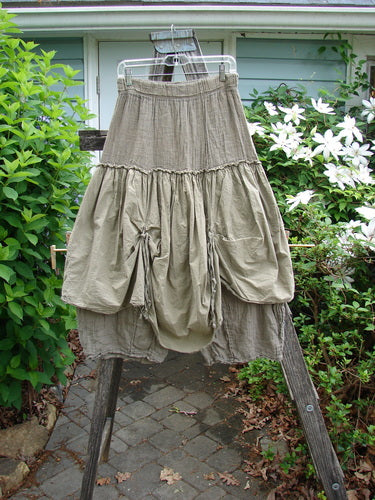 Barclay Linen Batiste Fusion Pant Skirt Unpainted Wheat Size 0 features a unique dual-layer design with elastic waist, triangular patches, and double tie accents, creating a billowy, artistic silhouette.