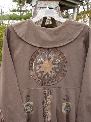 1994 Poppy Dress Belief Spirit Magic Humus Size 1, featuring a rounded collar, vintage pressed paper buttons, detailed design, and a star motif, from Bluefishfinder.com's Winter Collection of 1994 in perfect condition.