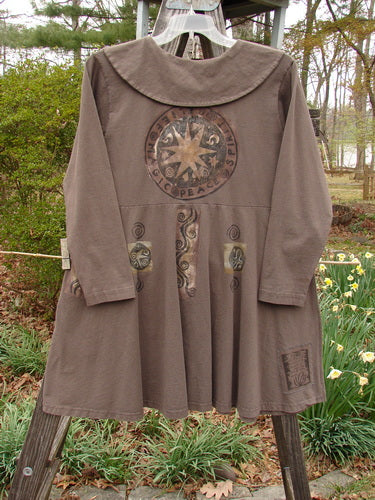 1994 Poppy Dress Belief Spirit Magic Humus Size 1, featuring a rounded collar, empire waist, and original vintage buttons, displayed on a clothesline.