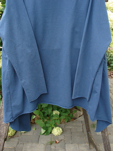 Barclay Cotton Lycra Gather Collar Open Front Jacket Unpainted Navy Size 2 draped over a wooden chair on a patio, highlighting its unique neckline and flowing hemline, embodying Bluefishfinder's vintage style.