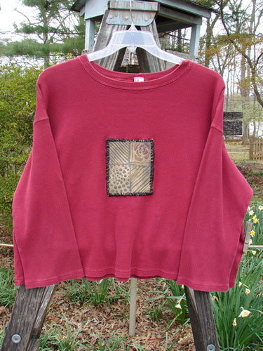 Barclay PMU Patched Thermal Boxy Crop Top Unpainted Cranberry Size 0, featuring a whip-stitched patch, square boxy shape, cropped length, and cozy long sleeves, displayed with fabric detailing.