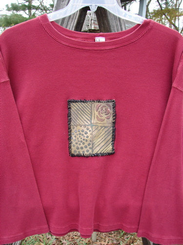 Barclay PMU Patched Thermal Boxy Crop Top Unpainted Cranberry Size 0 featuring a contrasting whip-stitched patch, boxy shape, rounded neckline, slight crop length, and long sleeves.