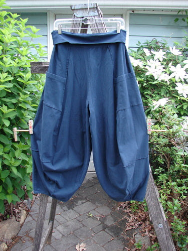 Barclay Cotton Lycra Fold Over 4 Square Pocket Pant in Navy showcases a fold-over waistline, unique 3D diamond cut from knee down, double exterior pockets, and billowy bottoms, embodying Bluefishfinder's vintage creativity.