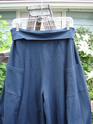 Barclay Cotton Lycra Fold Over 4 Square Pocket Pant features a fold-over waist, unique 3D diamond drape from knees, double exterior pockets, and exterior stitchery, showcasing Bluefishfinder's distinctive style.