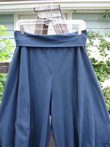 Barclay Cotton Lycra Fold Over 4 Square Pocket Pant in Navy, featuring a fold-over waistline, unique 3D diamond drape from knee, double exterior pockets, and intricate stitchery, perfect for expressing individuality.