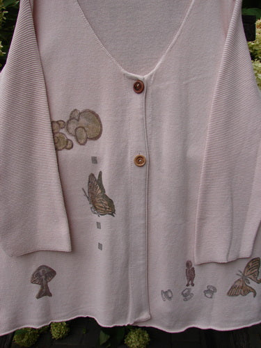 1994 2 Button Cardigan Sweater Magical Garden Pink Granite OSFA showcases a lightweight knit with a deep V-neck, wooden buttons, and whimsical motifs including clouds and butterflies, reflecting Bluefishfinder.com's vintage charm.
