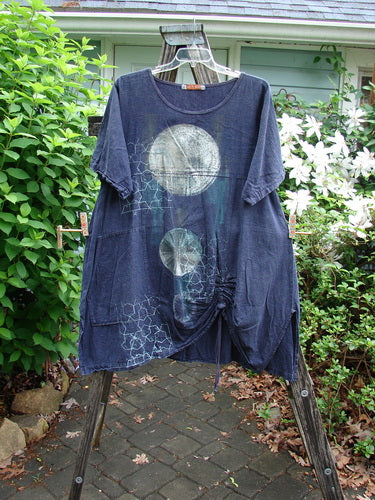 Barclay Hemp Vented Drawcord Dress Moon Night Denim Size 1, featuring a rounded neckline, kangaroo pocket, empire waist seam, vertical panels, and wide sleeves, embodying Bluefishfinder's vintage, creative style.