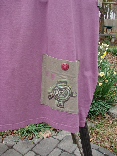 1997 Big Pocket Skirt Abstracts Crocus Size 1, close-up showcasing the drawstring waistline, unique bell-shaped bottom, and large lower exterior pocket with vintage Blue Fish button closure.