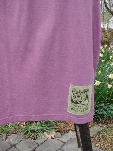 1997 Big Pocket Skirt Abstracts Crocus Size 1 featuring a drawstring waist, bell-shaped bottom, large lower pocket with button closure, and abstract theme paint details, made from organic cotton.