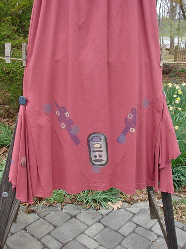 1996 Dubuffet Skirt Abstract Ember Size 2 features a full elastic waistband, lower diamond-shaped pleated panels with painted buttons, and removable painted flutters with lettuce edging.