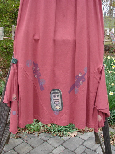 1996 Dubuffet Skirt Abstract Ember Size 2, featuring a full elastic waistband, diamond-shaped side panels with painted buttons, and detachable painted flutters with lettuce edging, all in mid-weight organic cotton.